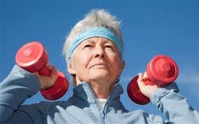 Old Woman Exercising With Dumbbells